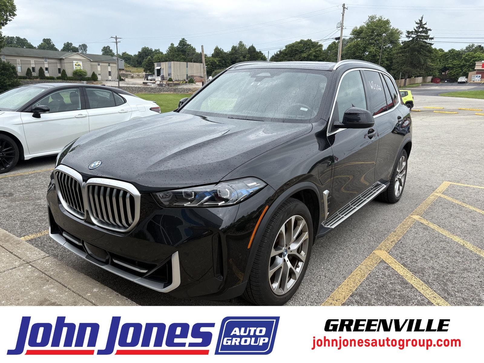 Used 2025 BLACK BMW XDRIVE50E PLUG-IN HYBRID image 1