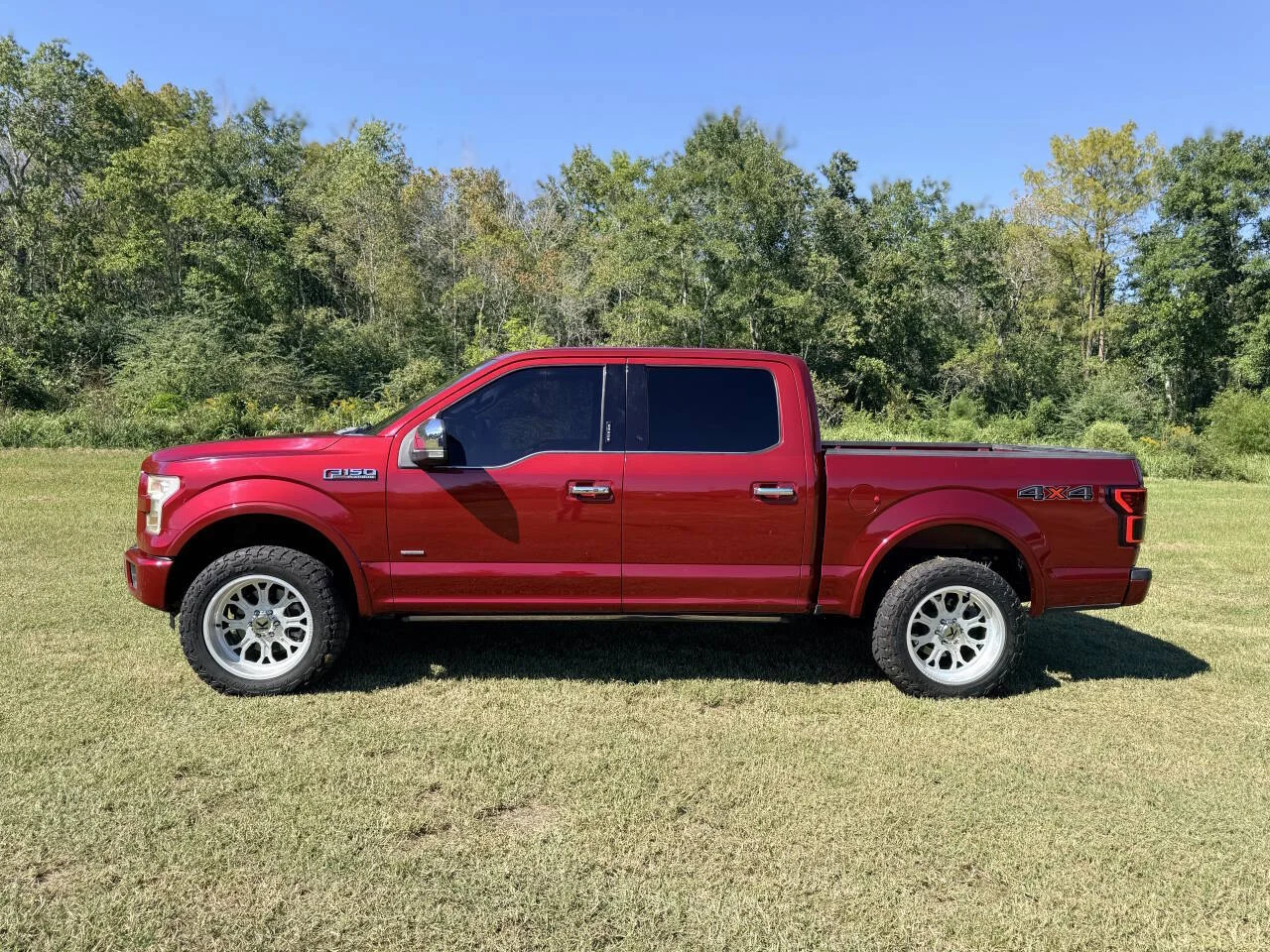 Used 2015 Red Ford Platinum 4x4 4dr SuperCrew 5.5 ft. SB image 2