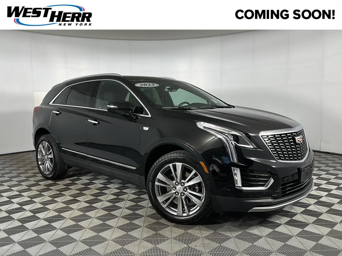 Used 2023 Stellar Black Metallic Cadillac AWD Premium Luxury image 1