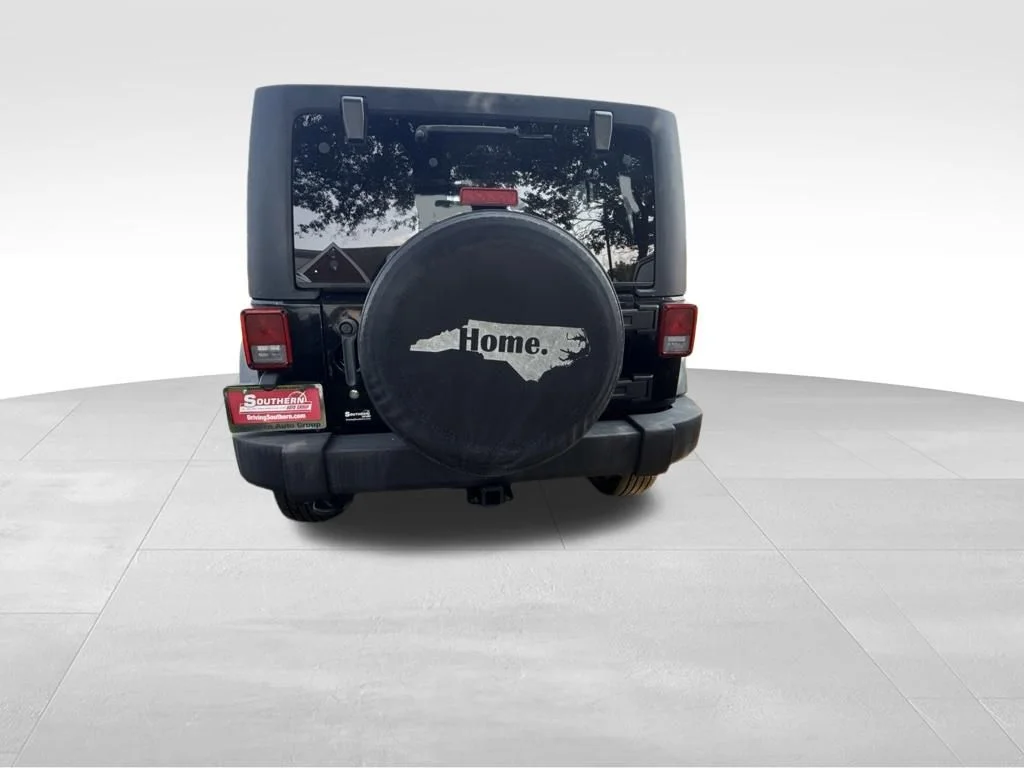 Used 2012 Black Jeep Unlimited Sport image 4