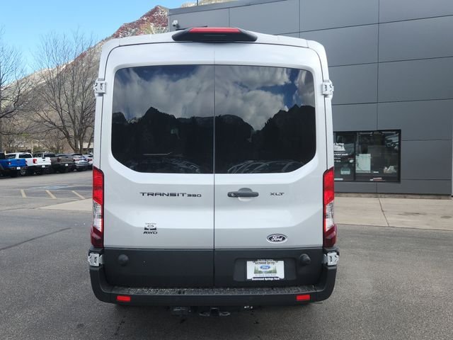 New 2026 Ingot Silver Metallic Ford Passenger Van XLT image 4