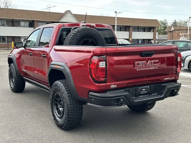 Used 2025 Volcanic Red Tintcoat GMC AT4 image 8