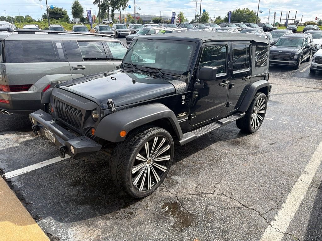 Used 2013 Black Jeep Unlimited Sahara image 2