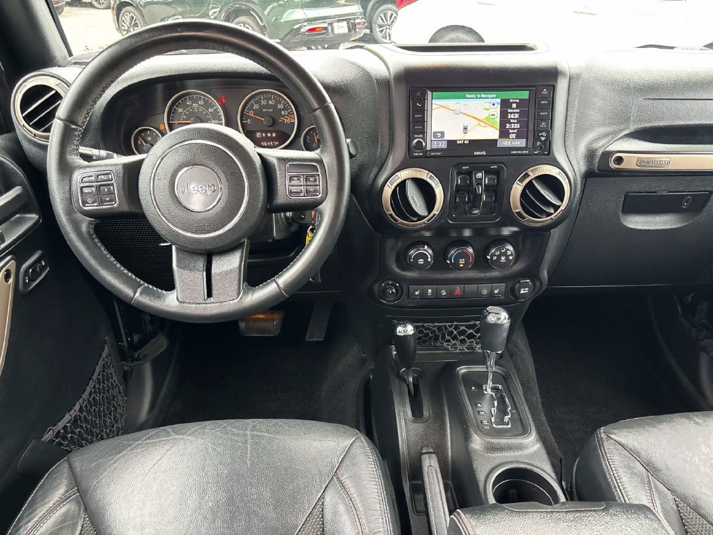 Used 2016 Black Jeep Unlimited Sahara image 11