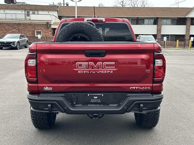 Used 2025 Volcanic Red Tintcoat GMC AT4 image 7