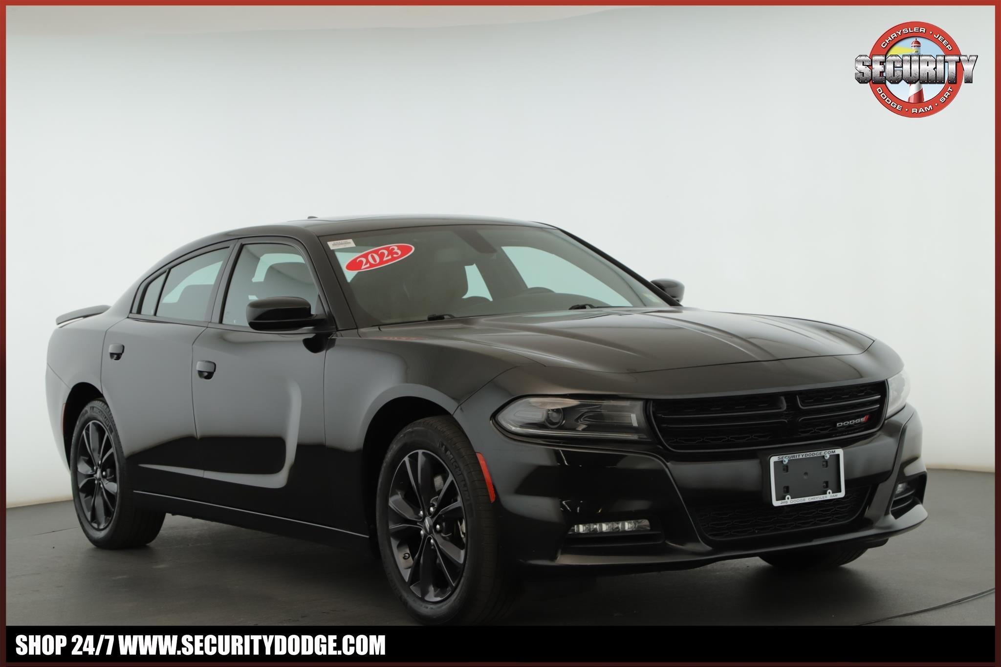 Used 2023 Pitch Black Clearcoat Dodge SXT AWD image 1