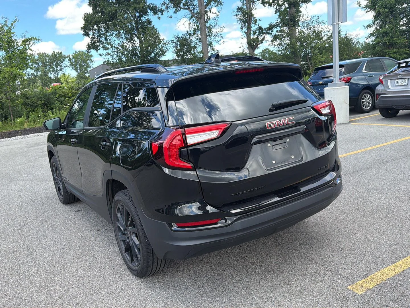 Used 2023 Ebony Twilight Metallic GMC SLE image 6