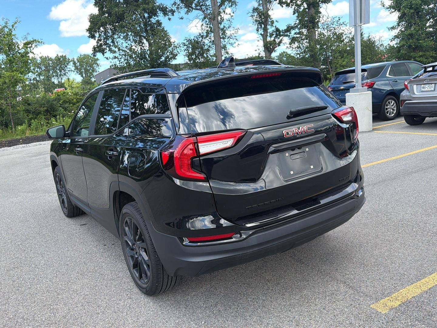 Used 2023 Ebony Twilight Metallic GMC SLE image 6