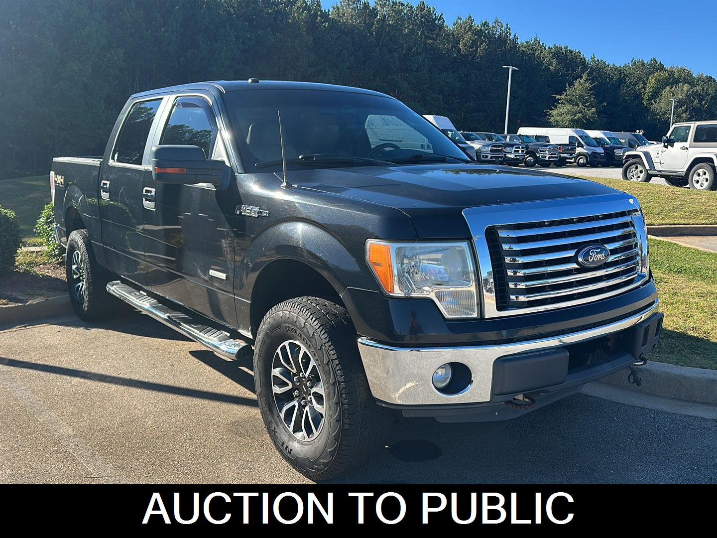 Used 2012 Tuxedo Black Metallic Ford XLT image 1