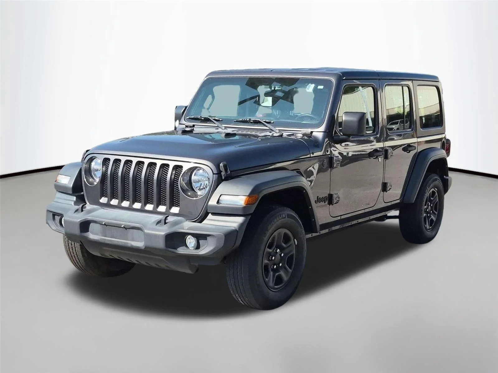 Used 2022 Granite Crystal Metallic Clearcoat Jeep Unlimited Sport image 1