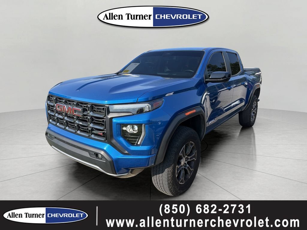 Used 2023 DYNAMIC BLUE METALLIC GMC 4WD AT4 image 1
