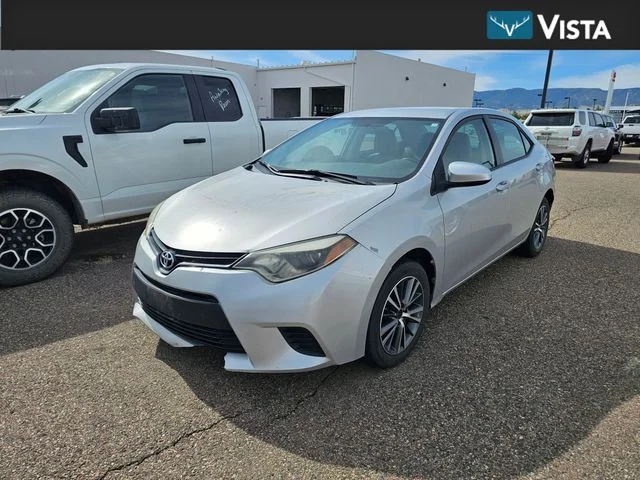 Used 2014 Classic Silver Metallic Toyota LE image 1