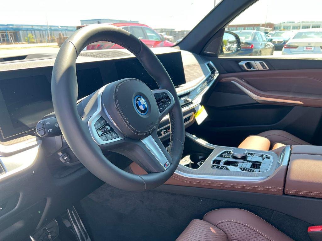 New 2026 Black Sapphire Metallic BMW xDrive50e image 4
