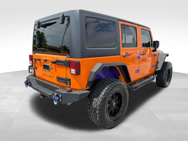 Used 2013 Orange Jeep Unlimited Rubicon image 7