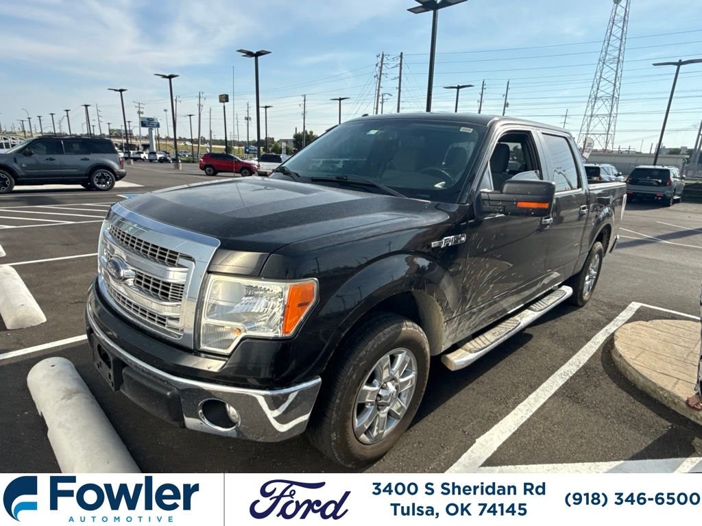 Used 2013 Black Ford XLT image 1