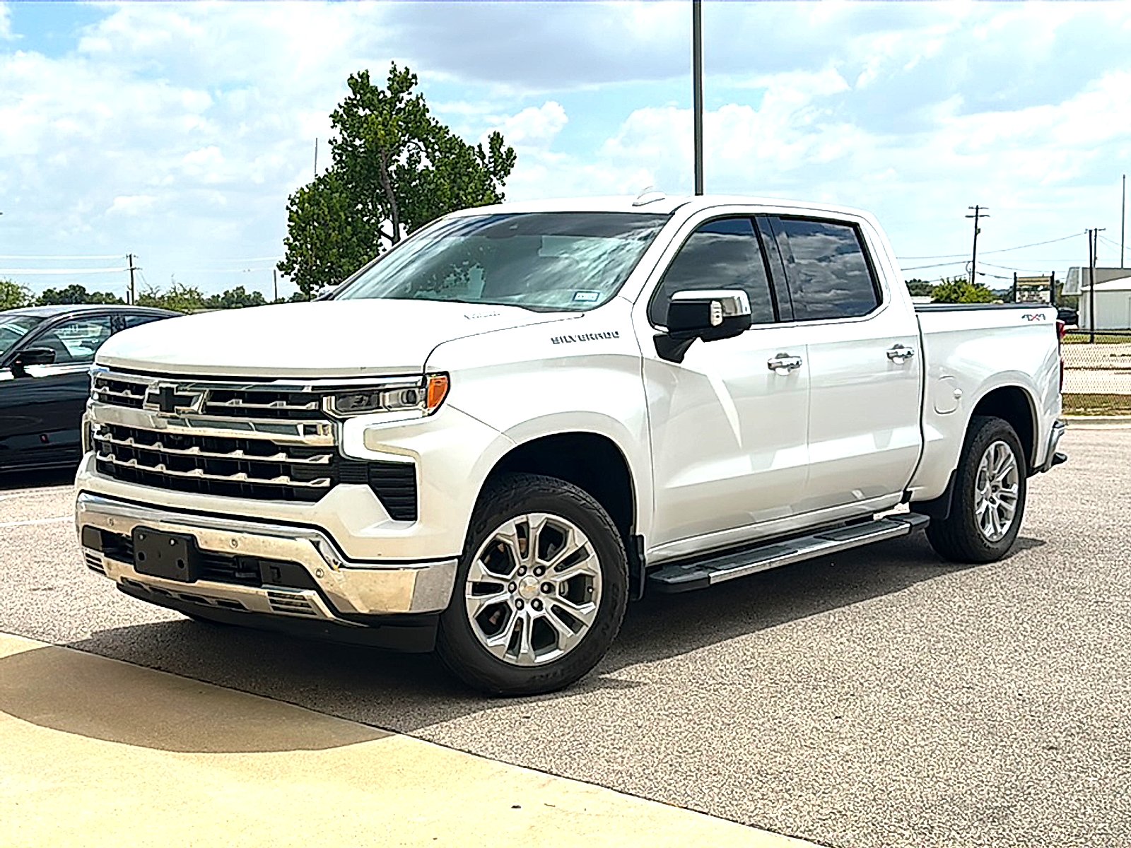 Used 2023 Summit White Chevrolet 4WD Crew Cab Short Bed LTZ image 2