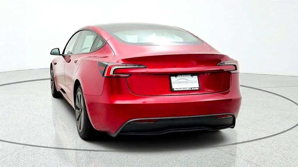 Used 2026 Ultra Red Tesla Long Range RWD w/ White & Black Premium Interior image 6