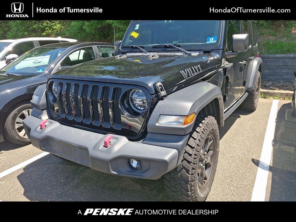 Used 2020 Black Clearcoat Jeep Unlimited Sport image 1
