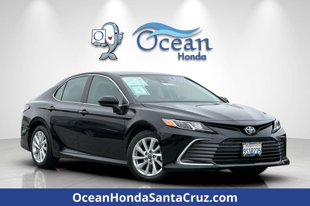 Used 2023 Midnight Black Metallic Toyota LE image 1