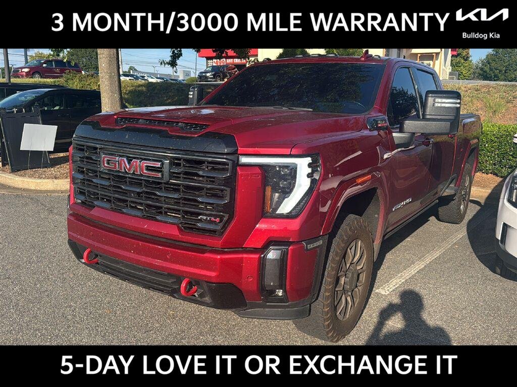 Used 2024  GMC 4WD Crew Cab 159" AT4 image 1