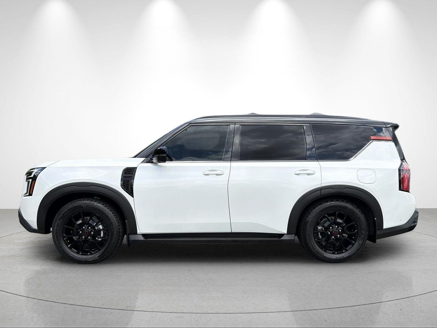 Used 2025 Aspen White Tricoat/Super Black Nissan PRO-4X image 2