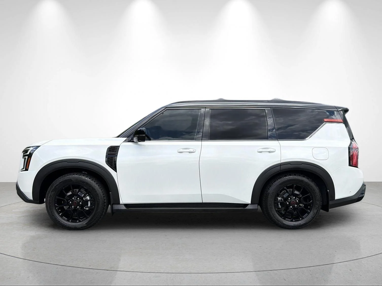 Used 2025 Aspen White Tricoat/Super Black Nissan PRO-4X image 2