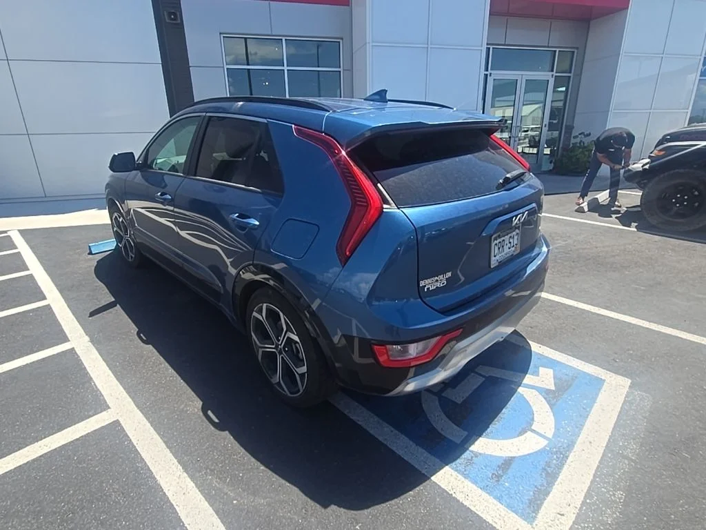 Used 2023 Mineral Blue Kia EX Touring image 5