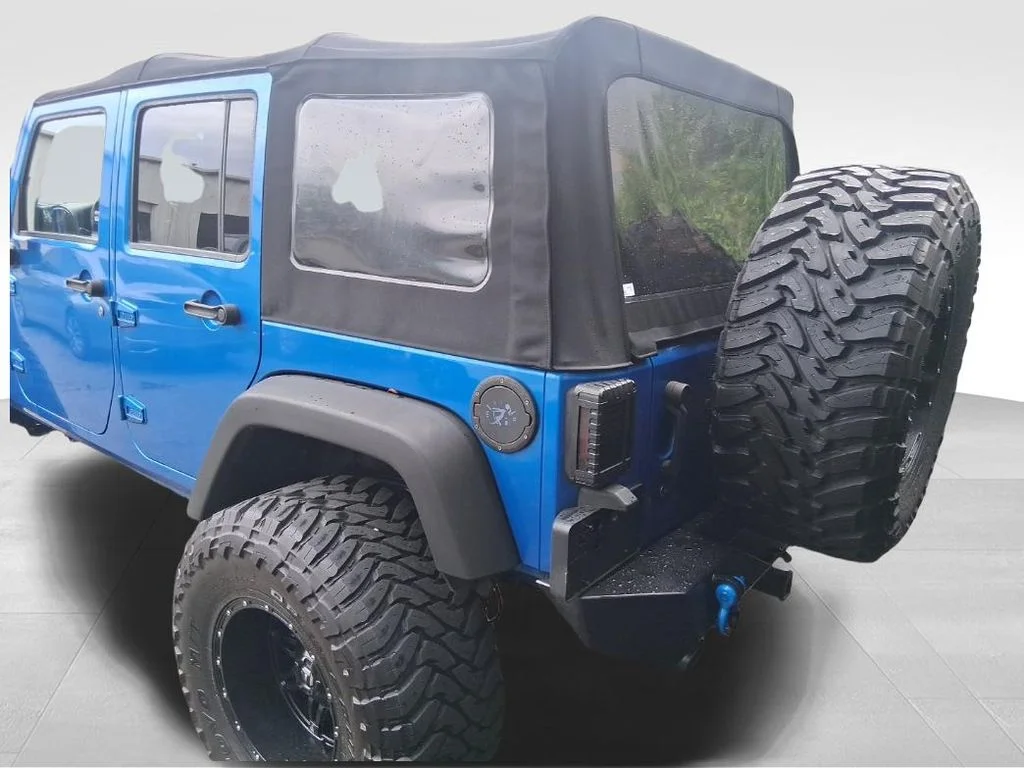 Used 2015 Blue Jeep Unlimited Sport image 14