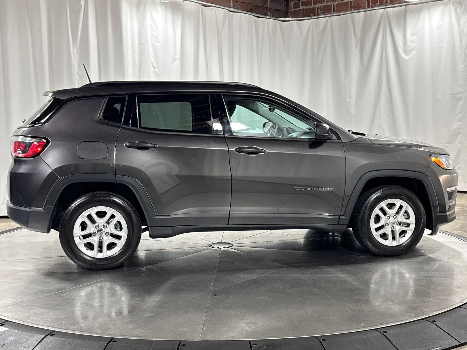 Used 2018 Granite Crystal Metallic Clearcoat Jeep Sport image 6