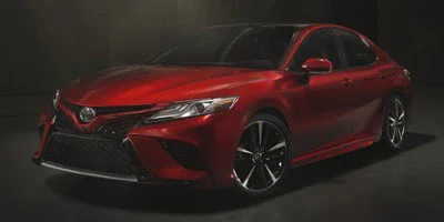 Used 2018 CELESTIAL SILVER METALLIC Toyota SE image 1
