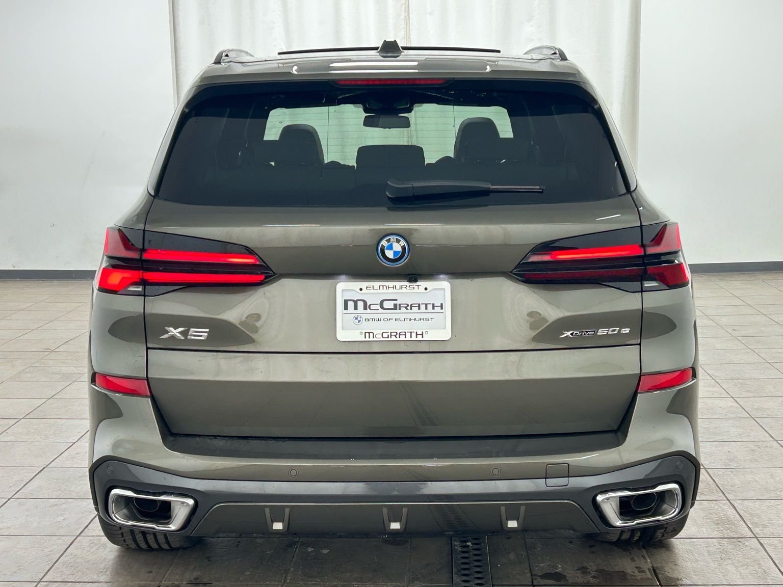 New 2026 Manhattan Green Metallic BMW xDrive50e image 5
