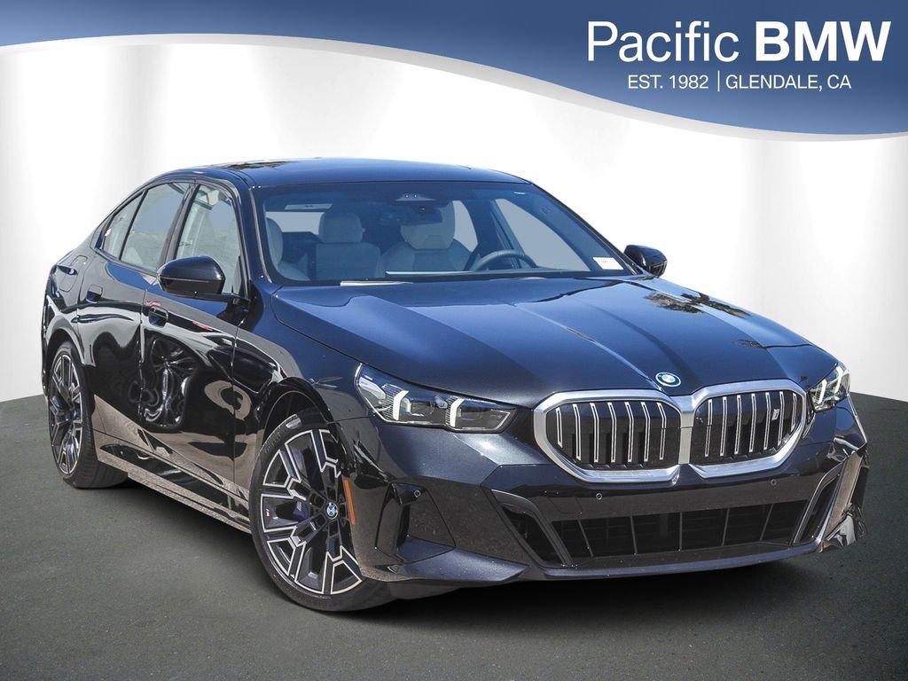 Certified Used 2026 Black Sapphire Metallic BMW eDrive40 image 1