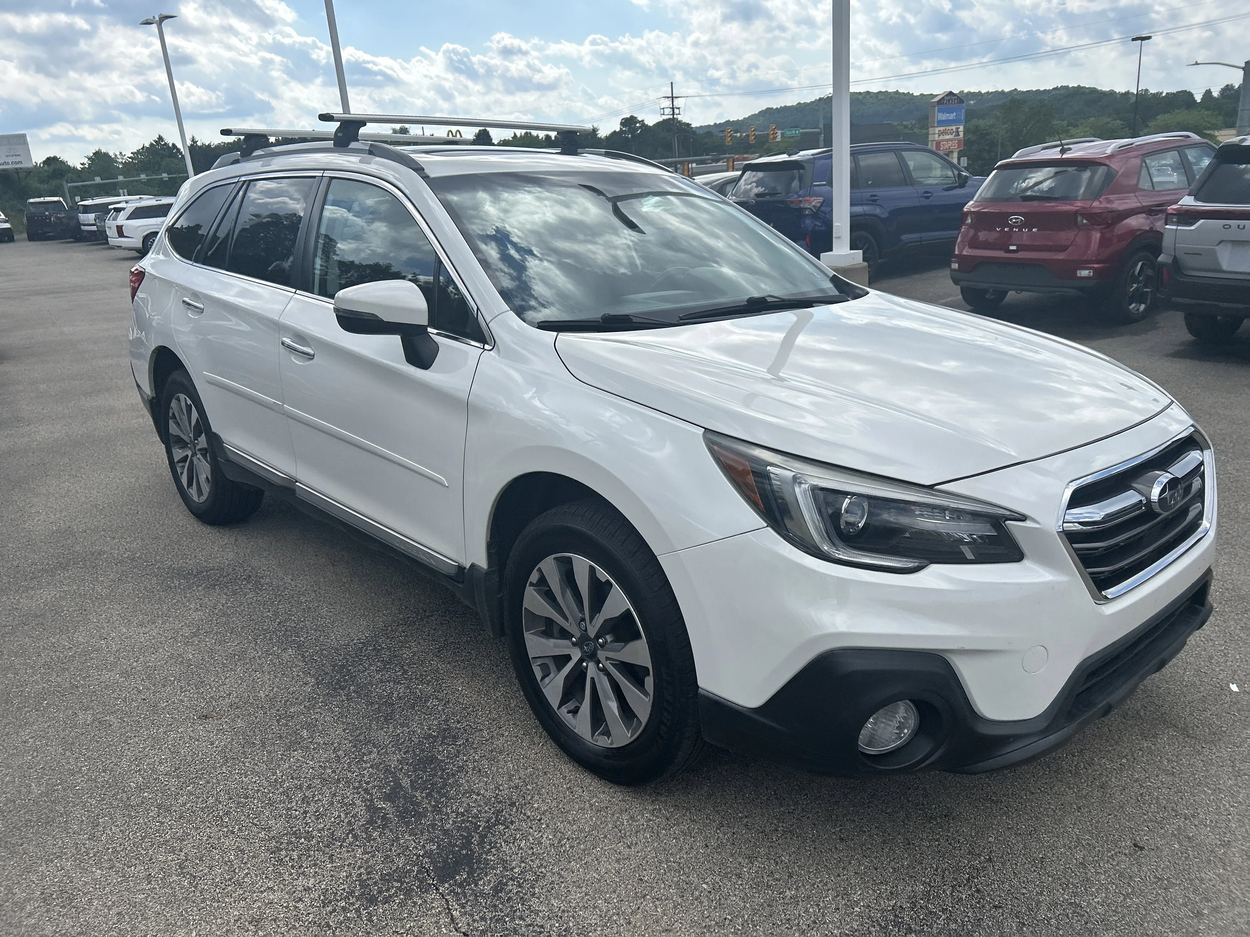Used 2018 Crystal White Pearl Subaru Touring image 1