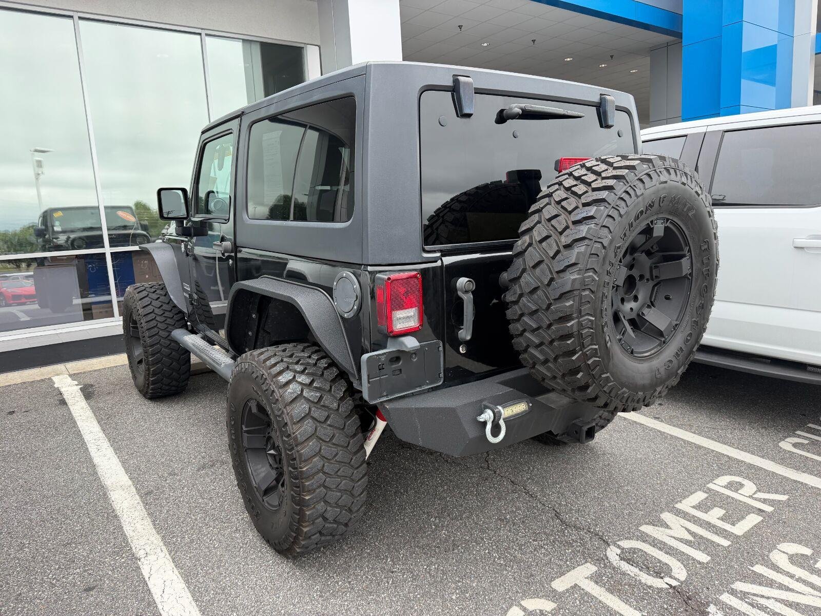 Used 2014 Black Clearcoat Jeep Sport image 3