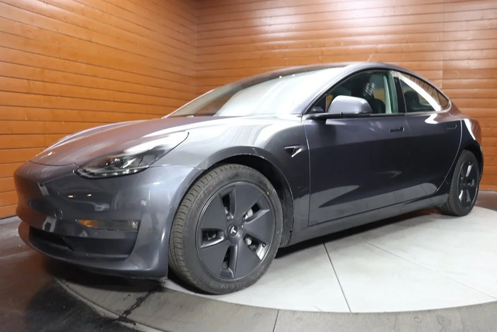 Used 2023 Solid Black Tesla Base image 1