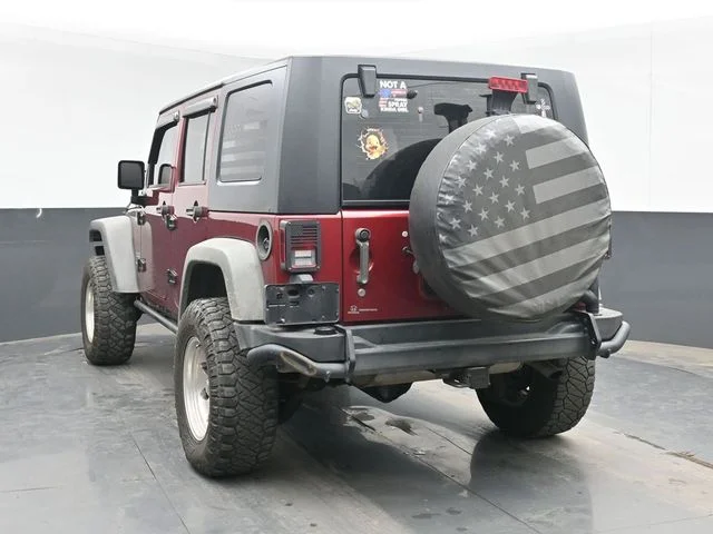 Used 2012 Red Jeep Unlimited Sport image 6