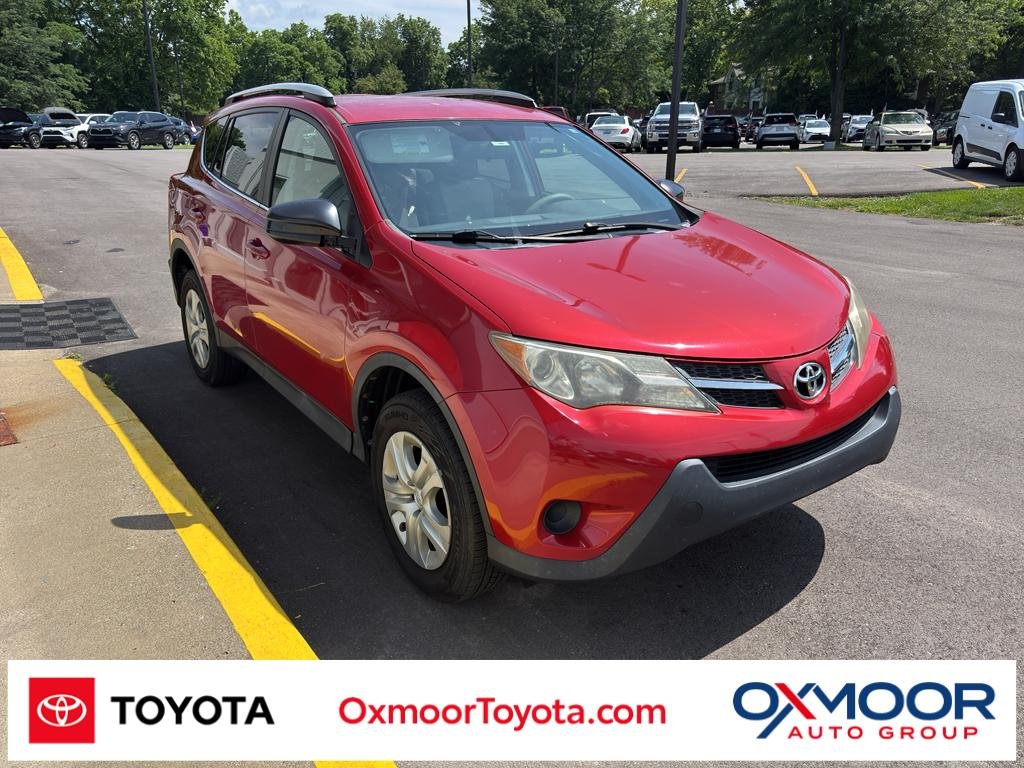 Used 2015 Barcelona Red Metallic Toyota LE image 1