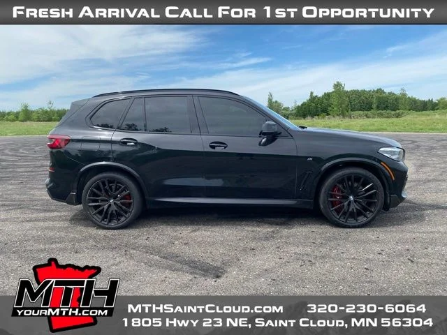 Used 2022 Black BMW M50i image 1