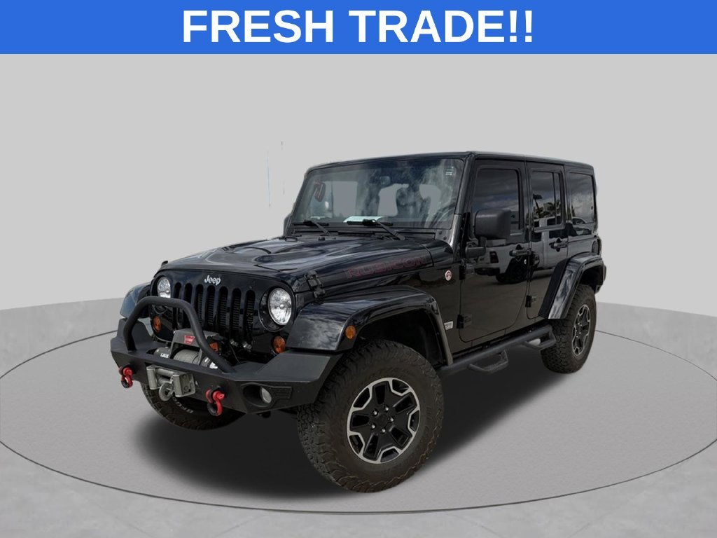 Used 2013 Black Jeep Unlimited Rubicon image 1