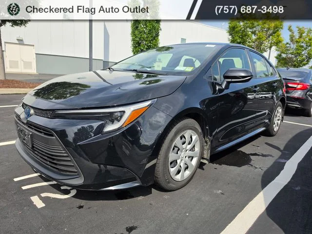 Used 2023 Midnight Black Metallic Toyota LE image 1