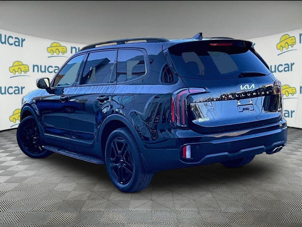 Used 2024 Ebony Black Kia EX X-Line image 4