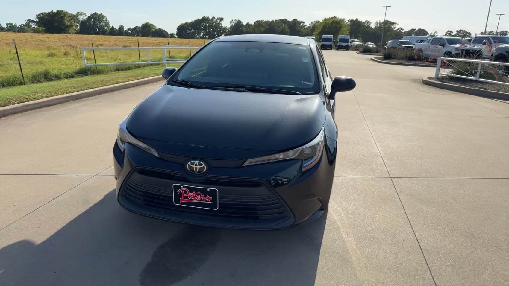 Used 2024 Midnight Black Metallic Toyota LE image 4
