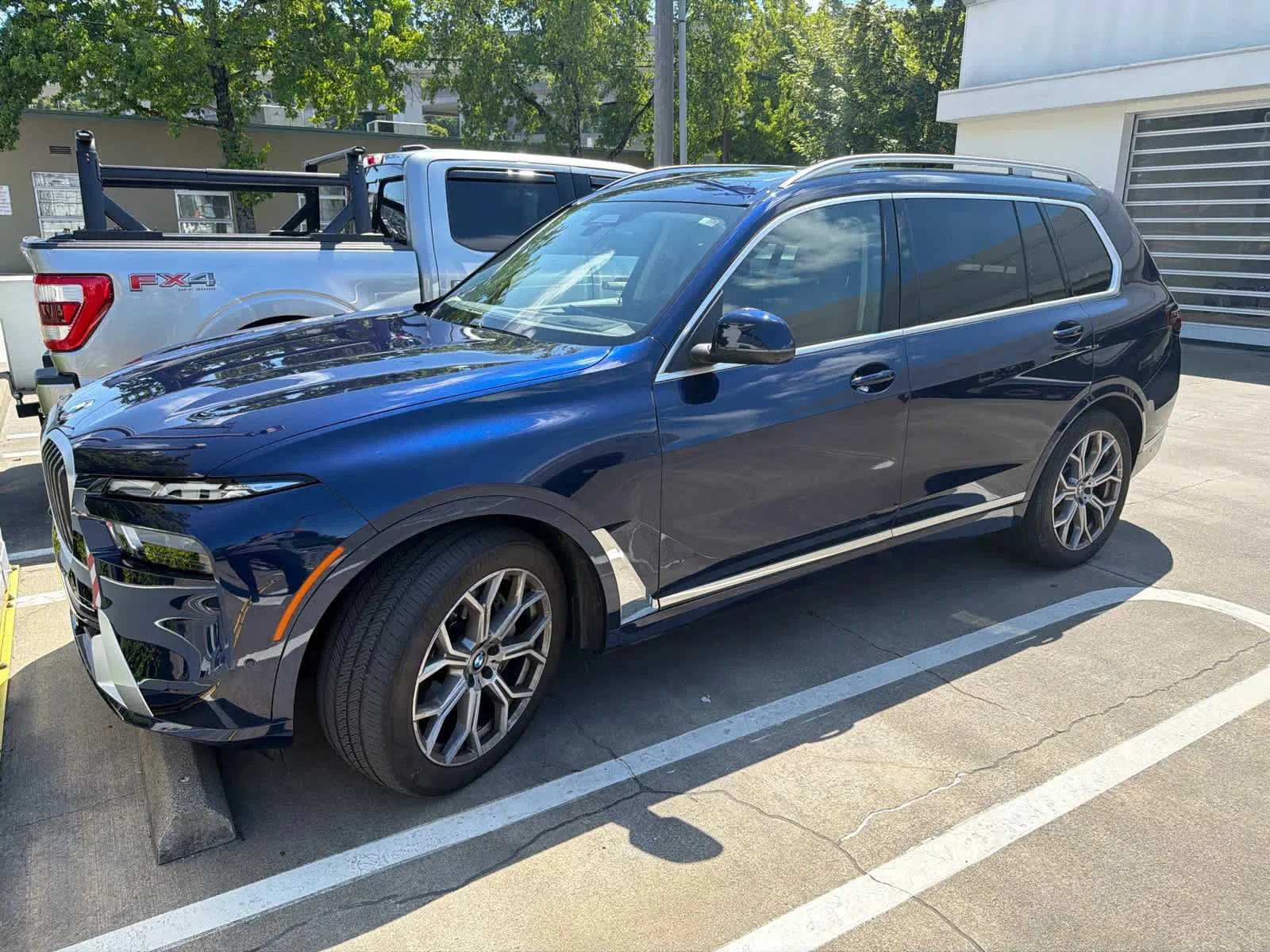 Used 2024 Tanzanite Blue II Metallic BMW xDrive40i image 1