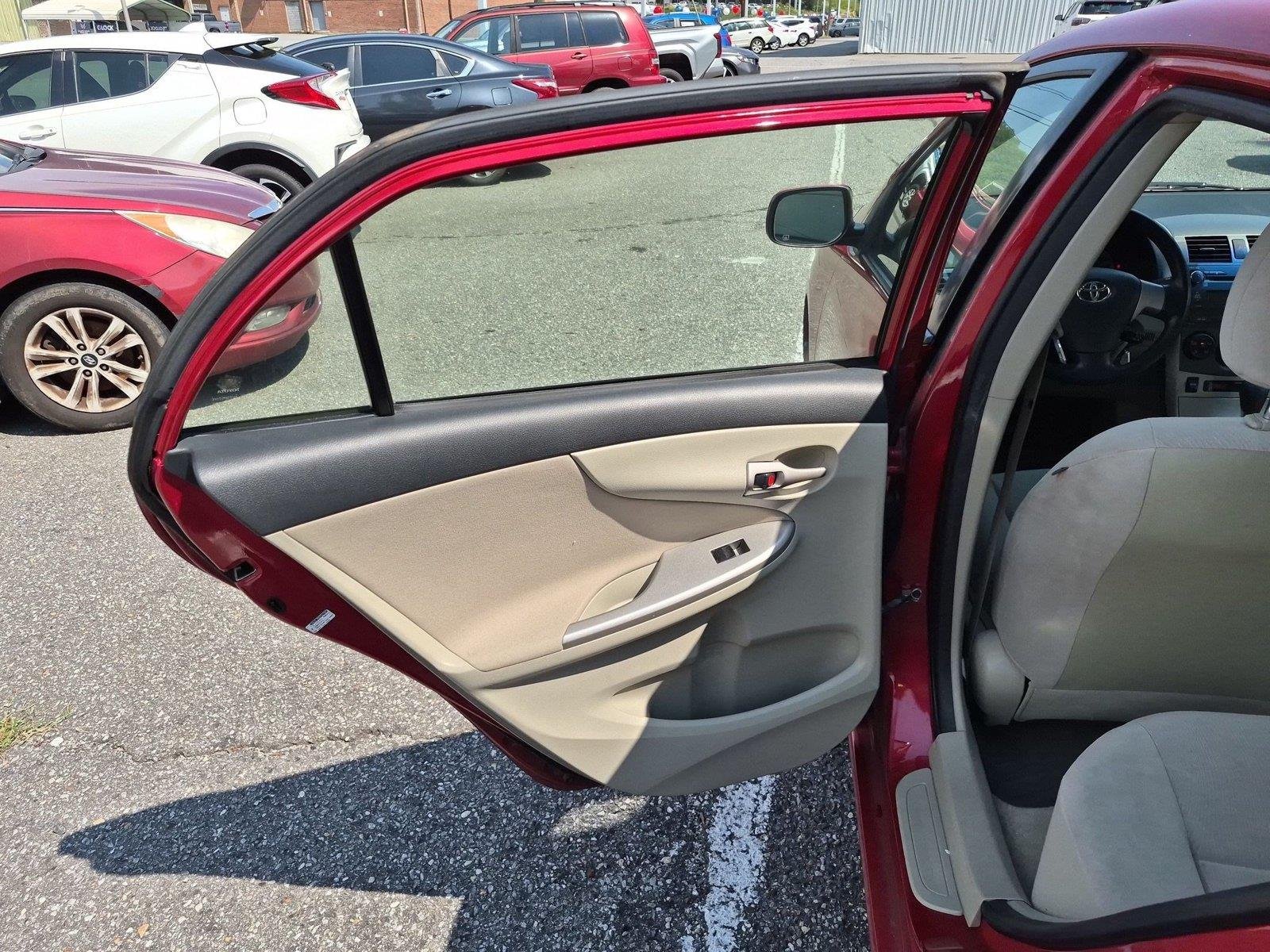 Used 2011 Barcelona Red Metallic Toyota LE image 25