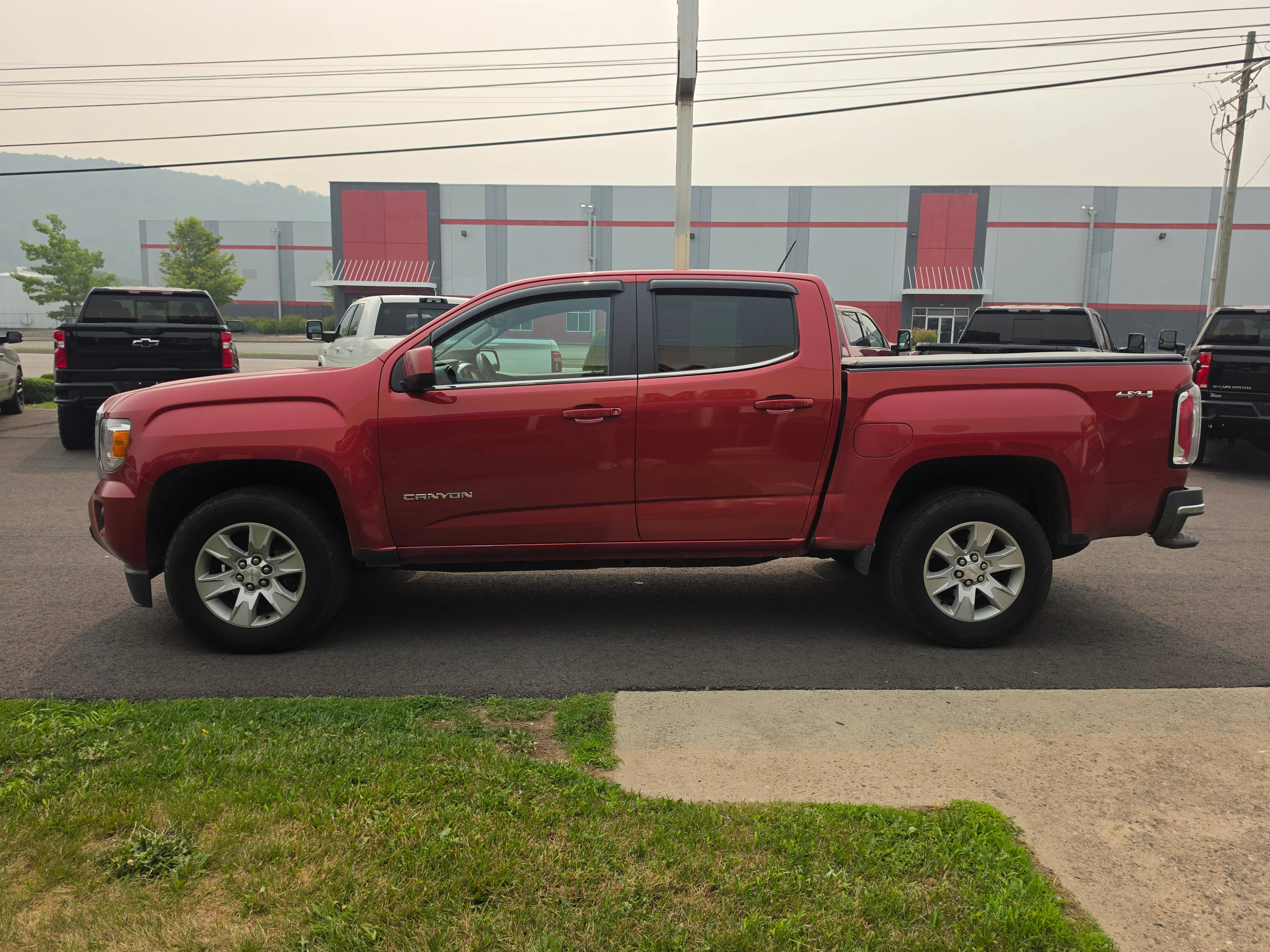 Used 2016 Copper Red Metallic GMC 4WD SLE image 7