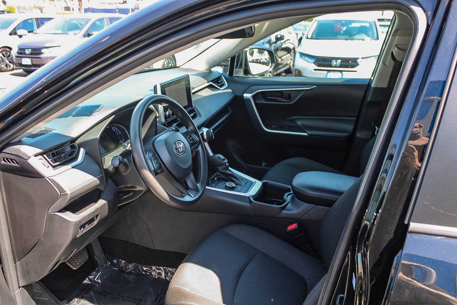 Used 2024 Midnight Black Metallic Toyota Hybrid LE image 18