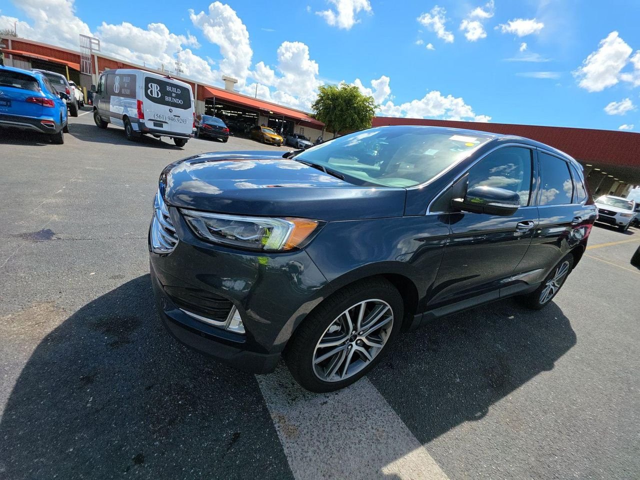 Used 2024 Stone Blue Metallic Ford Titanium image 1