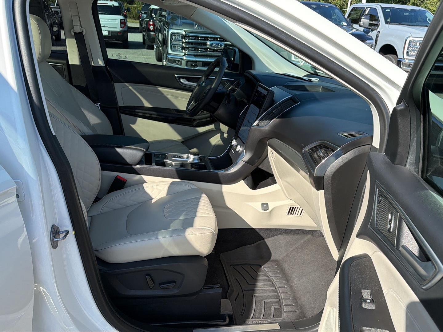 Used 2024 Star White Metallic Tri-Coat Ford Titanium image 14