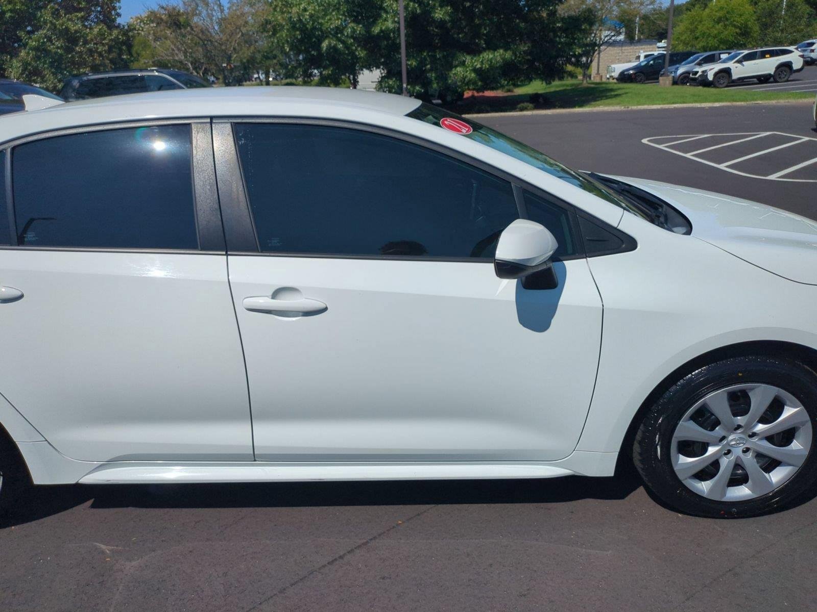 Used 2021 Super White Toyota LE image 33