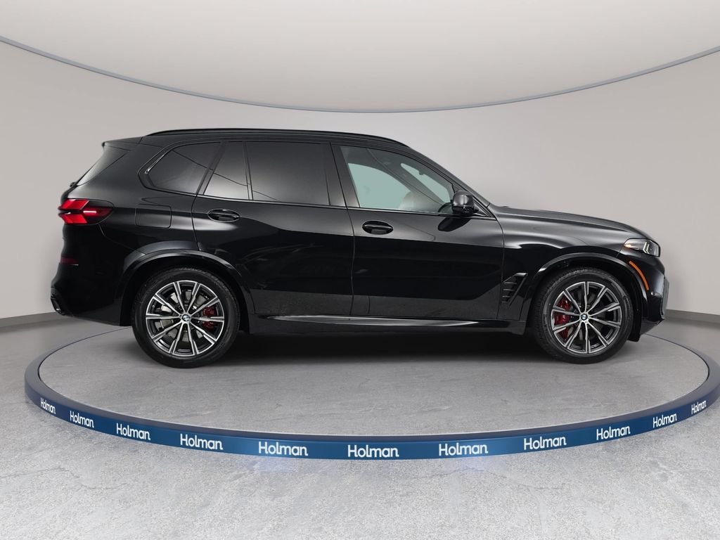 New 2026 Black Sapphire Metallic BMW xDrive50e image 4